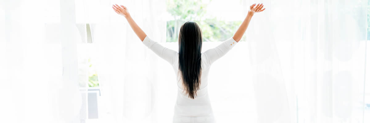 Woman Standing At Window Getting Sun And Breathing Fresh Air Woman Standing At Window Getting Sun And Breathing Fresh Air