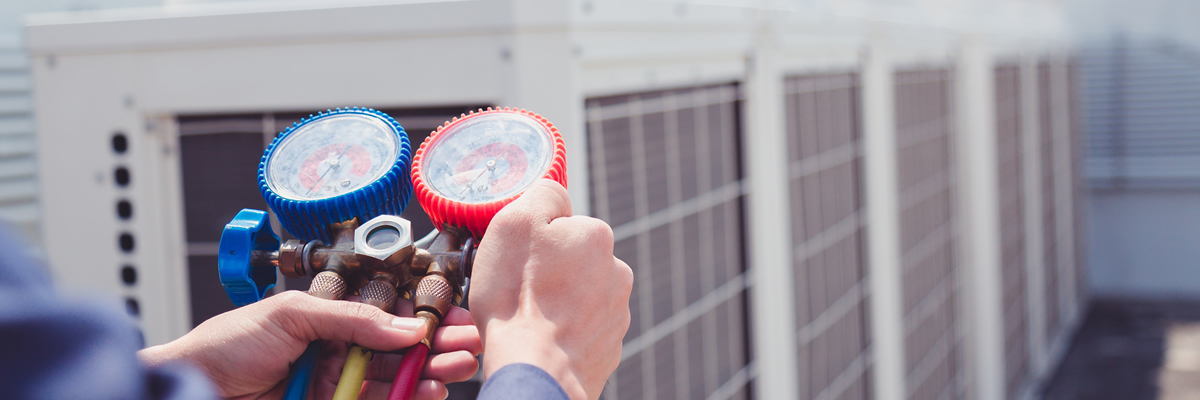 Commercial Hvac Tech Working On System Commercial Hvac Tech Working On System