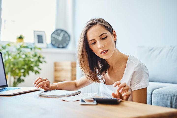 Woman Calculating Funds