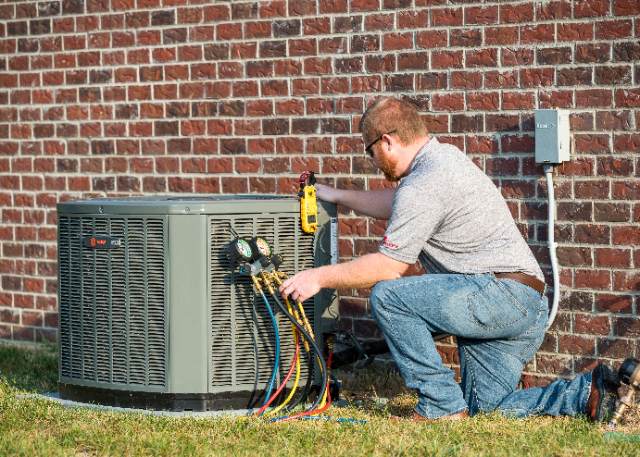 Lambs Heating And Air Conditioning Tech Working On Trane Ac System Lambs Heating And Air Conditioning Tech Working On Trane Ac System